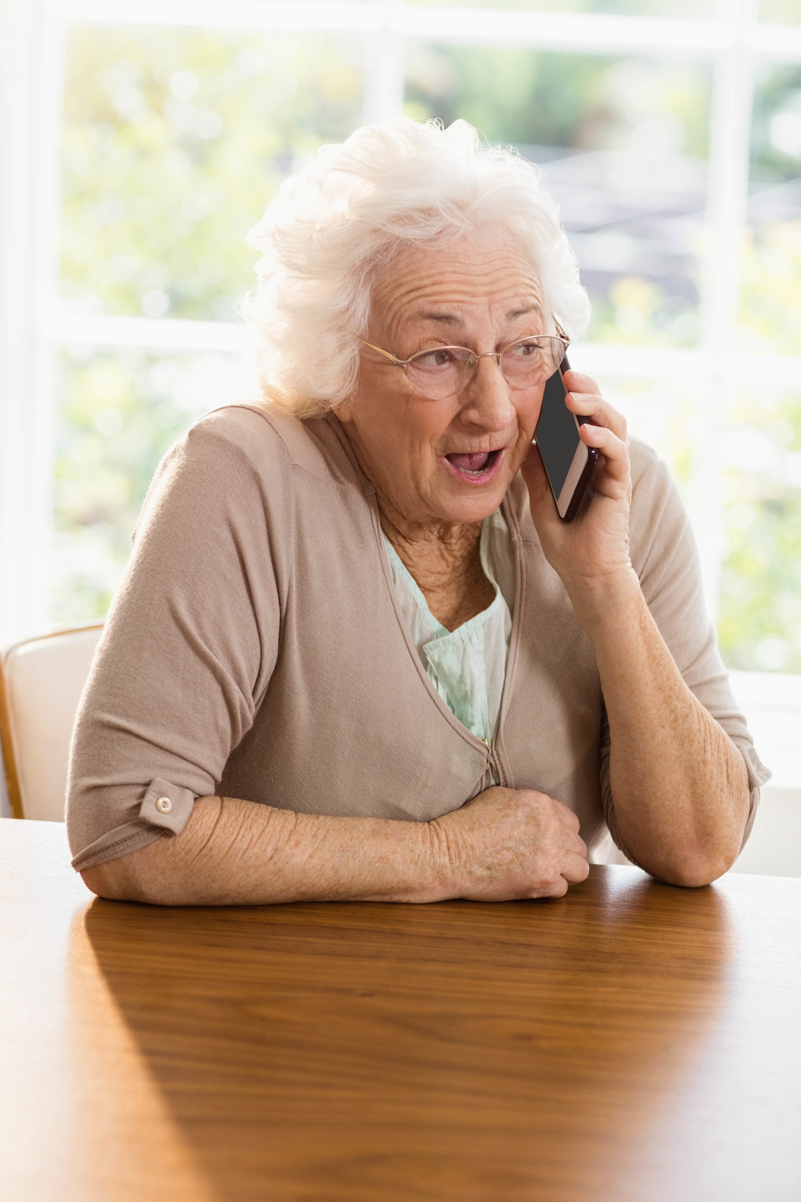 Elderly woman with Alzheimer's trying to have a conversation incoherently.