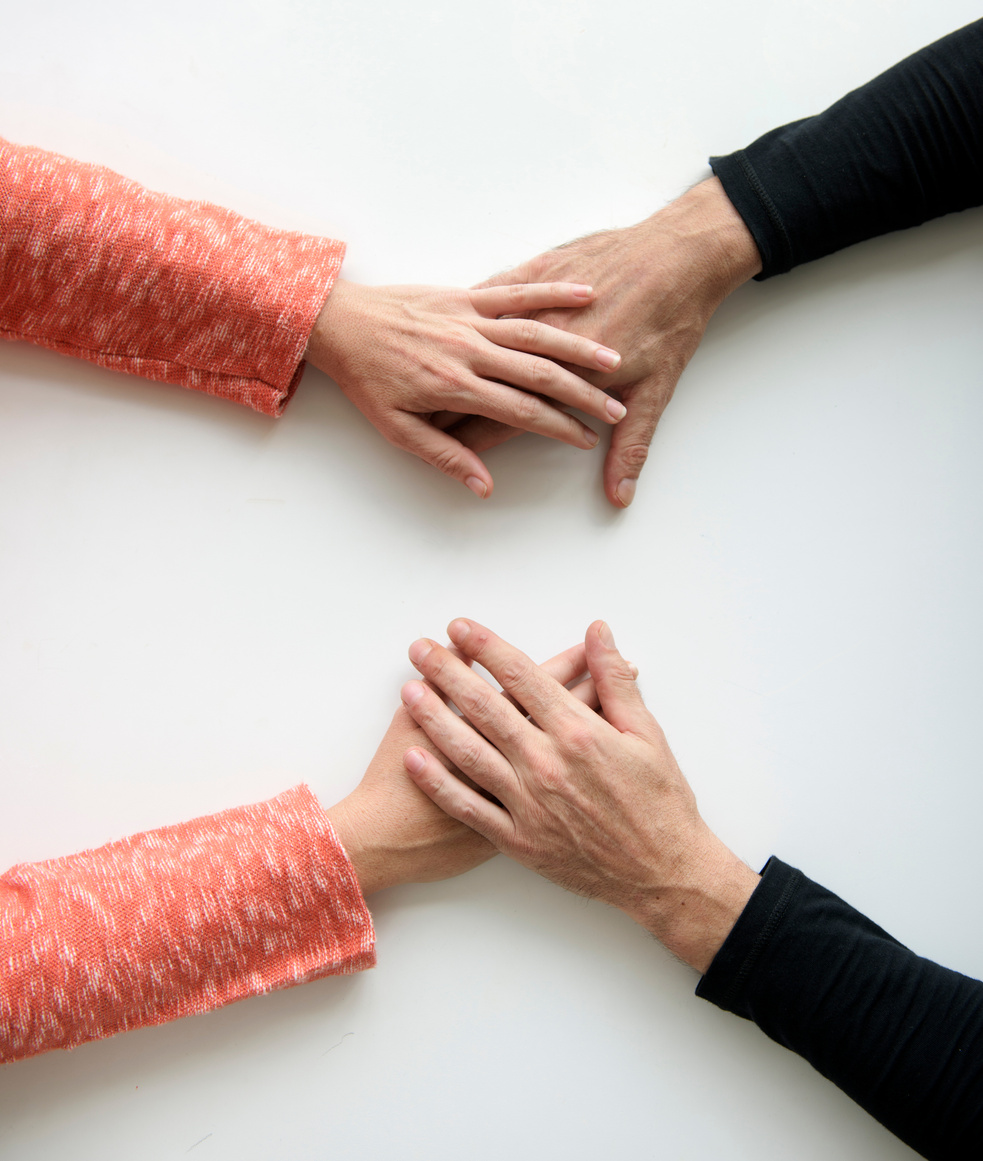 Hands reassurance for Alzheimer's care.